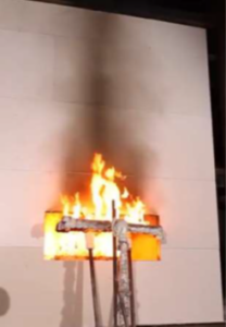 Figure 1: An NFPA 285 with a test specimen is shown with a fire plume extending up the wall