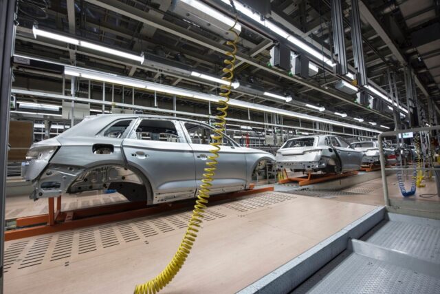 automobile manufacturing utilizing hybrid composite metal components
