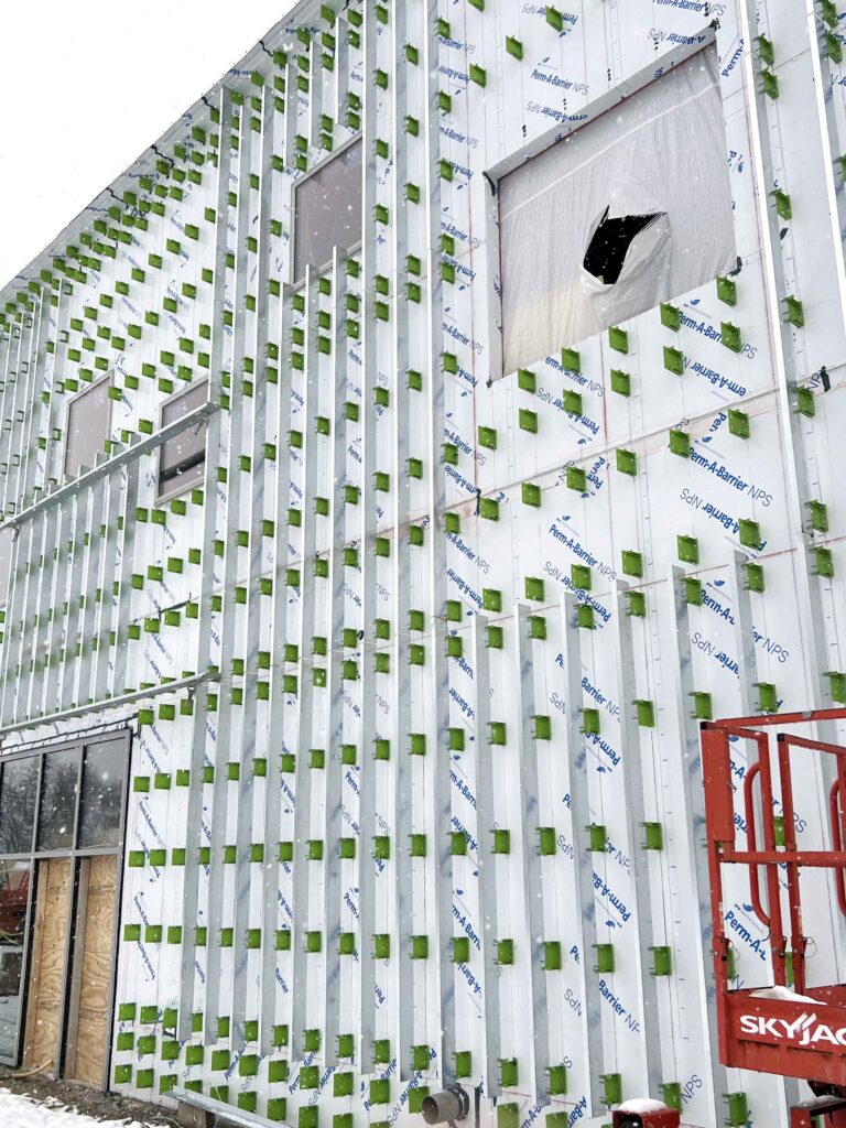 Academy for Global Citizenship building project features the GreenGirt Delta adjustable continuous insulation system.