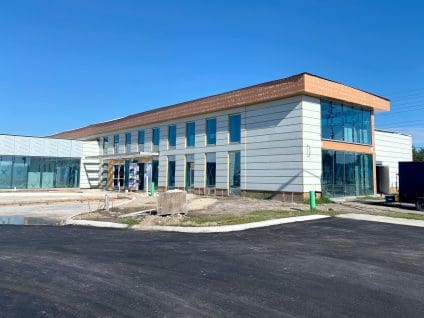 Osceola Tech Library under construction with white SMARTci insulation panels, green GreenGirt Max CMH Z-girts, and a copper colored weather barrier